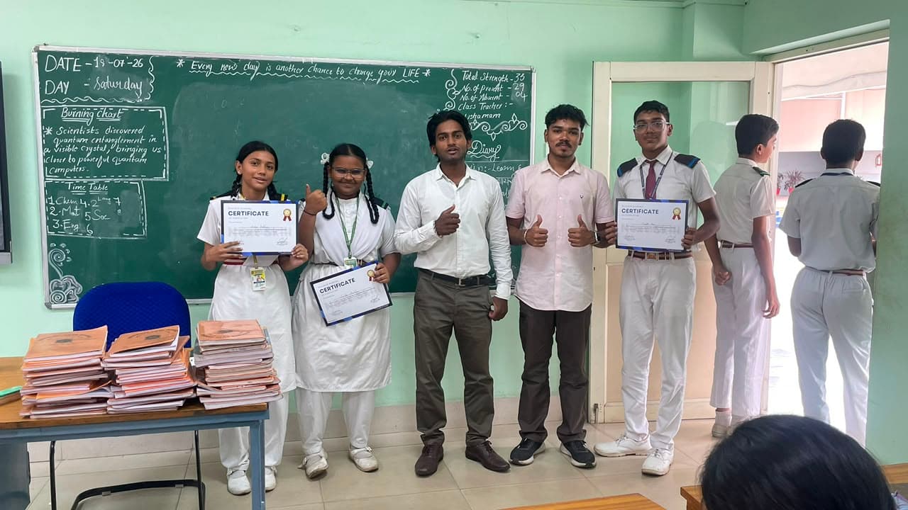 Students from multiple classes proudly displaying their NextSkill certificates after completing AI awareness and coding sessions.